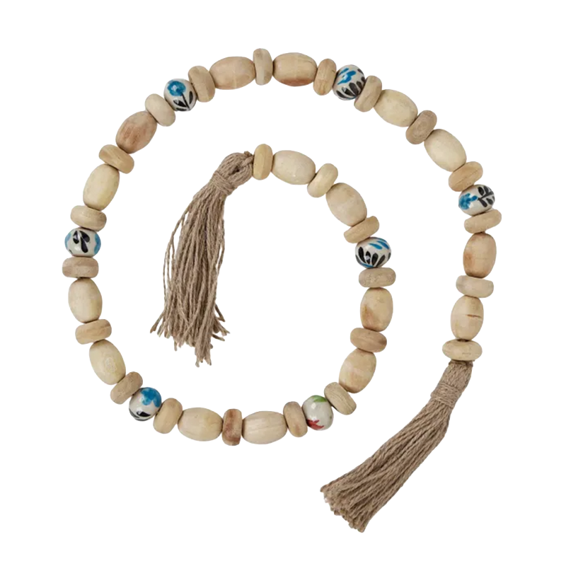 Natural wood and ceramic bead garland with tassel detailing