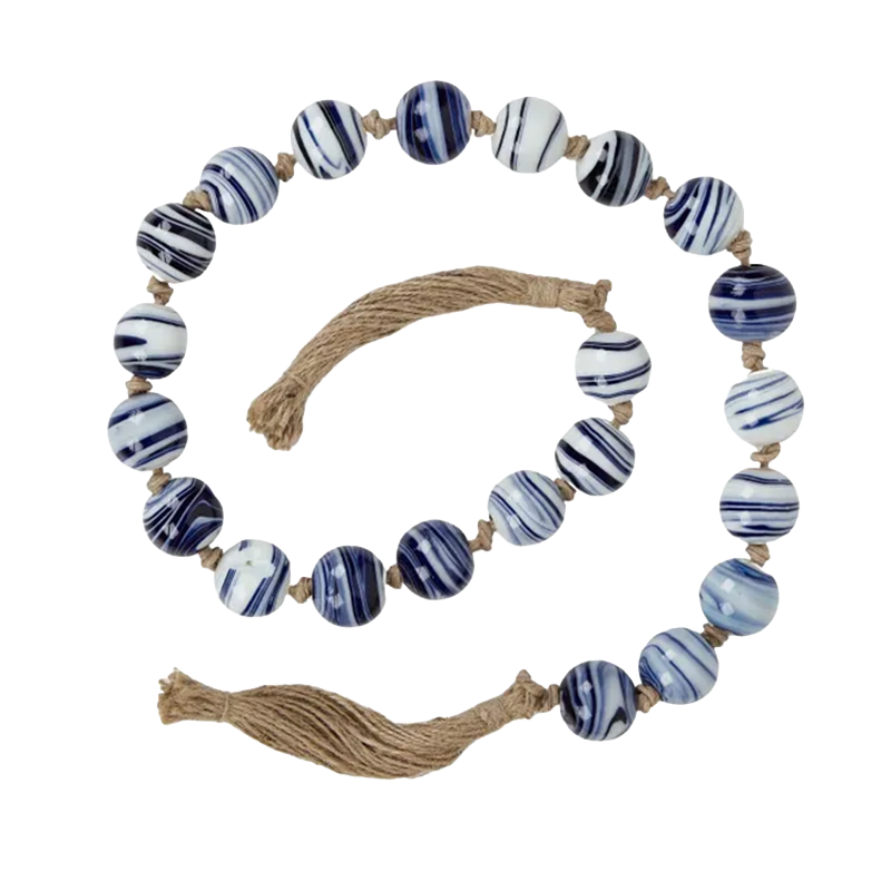 Blue and white swirled glass bead garland with natural tassels