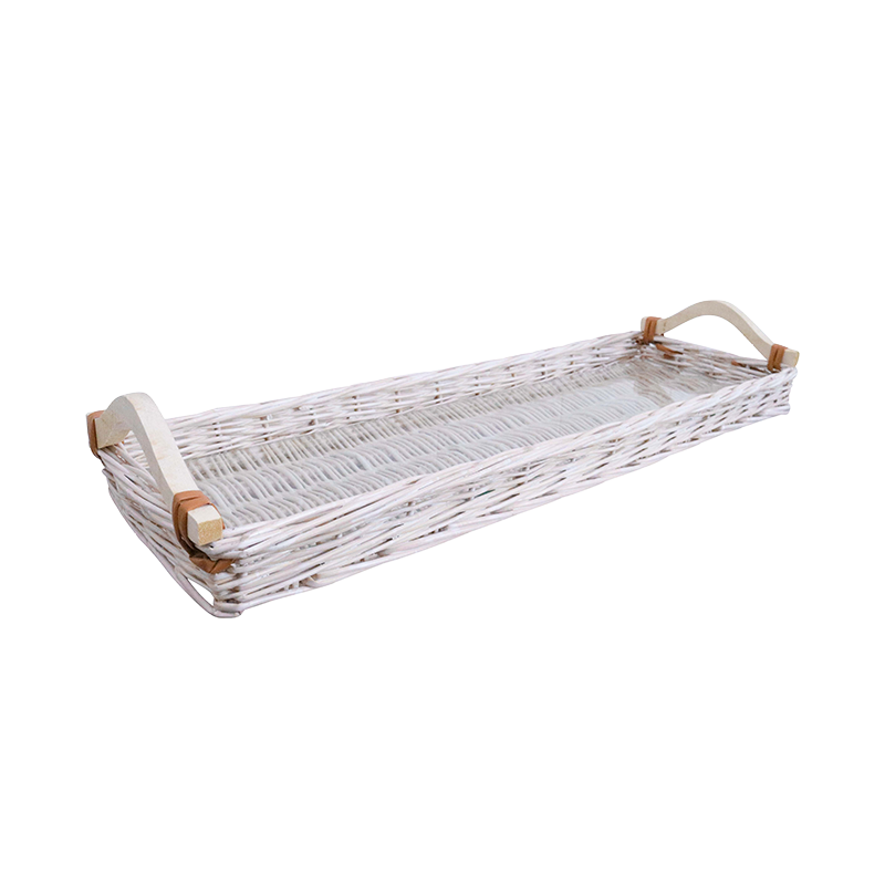White wicker tray with wooden handles on a white background