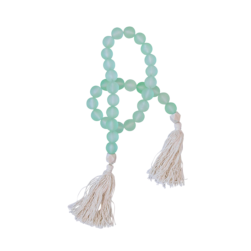 Garland with mint green beads and white tassels