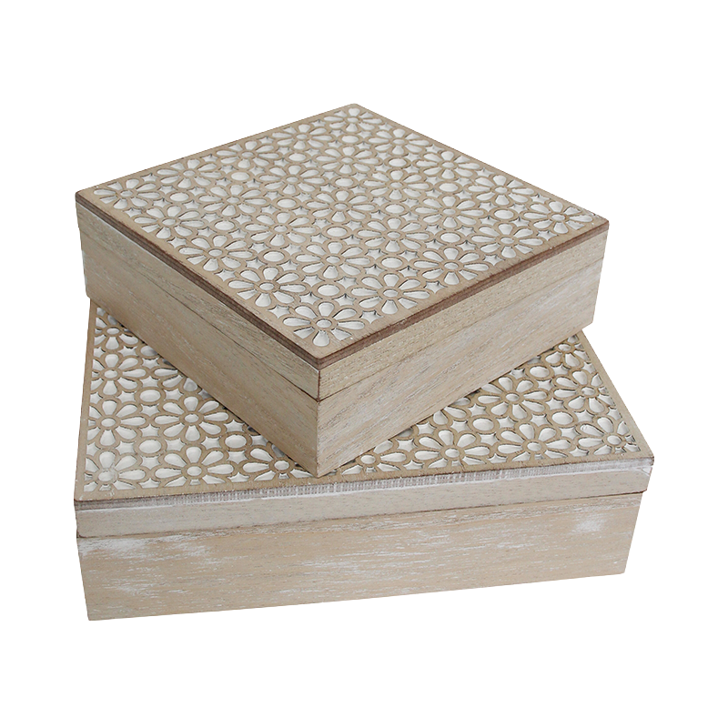 Two wooden boxes with decorative patterns