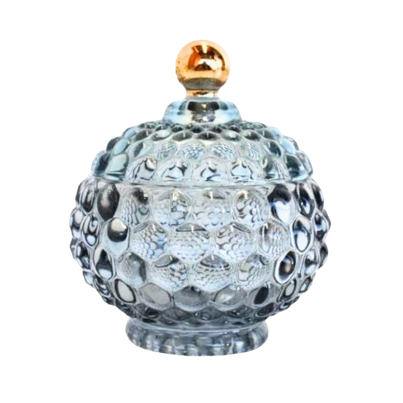 Decorative glass jar with a textured surface and gold lid 