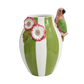 Ceramic vase with green and white stripes, floral design, and parrot figurine 