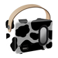 Portable cow print Bluetooth speaker with carry handle and side speaker detail.