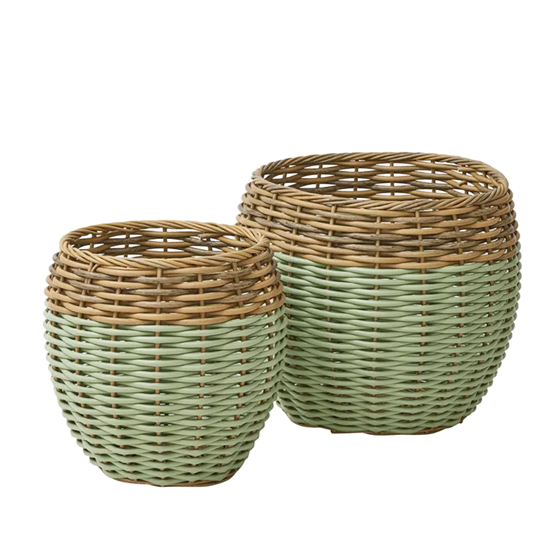 set of woven natural and sage green rattan baskets in two sizes