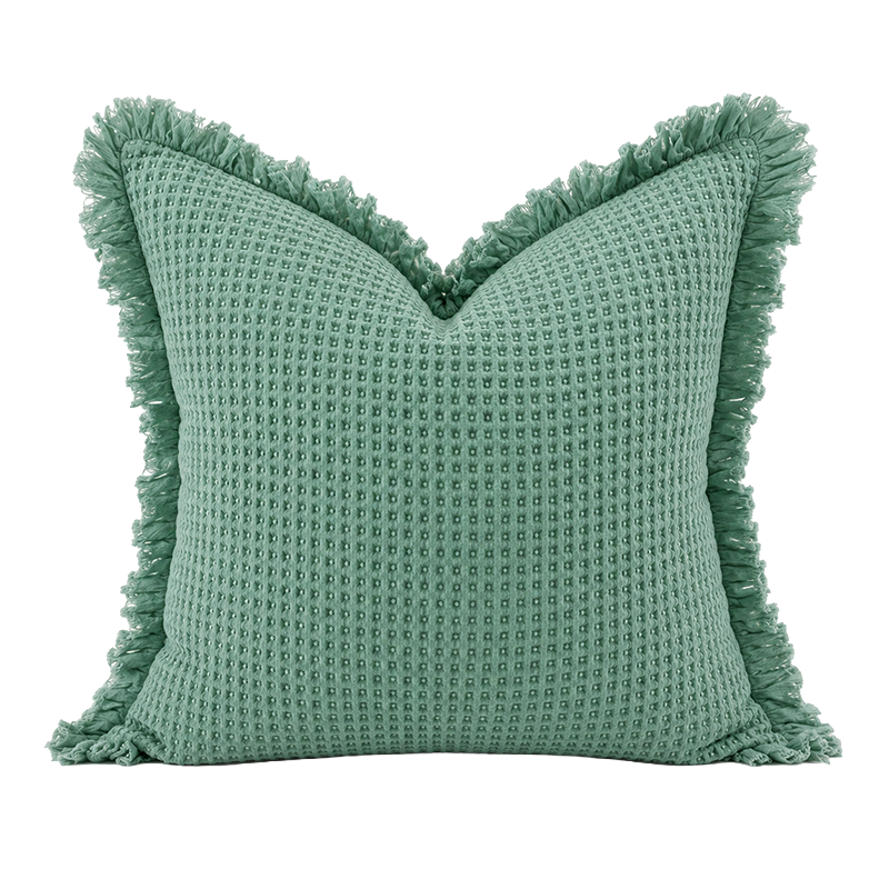 Sea green organic waffle cushion cover with textured weave and frayed edge detail