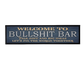 Decorative sign with humorous text on a white background