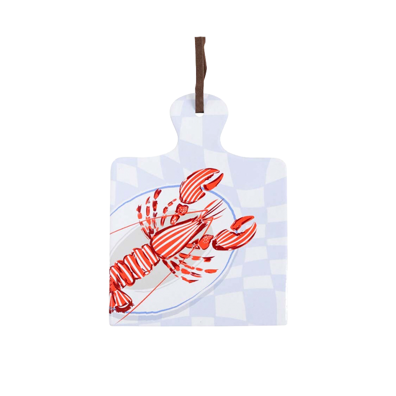 Coastal lobster trivet with red lobster illustration, ceramic surface and cork backing.
