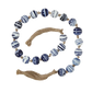 Blue and white swirled glass bead garland with natural tassels