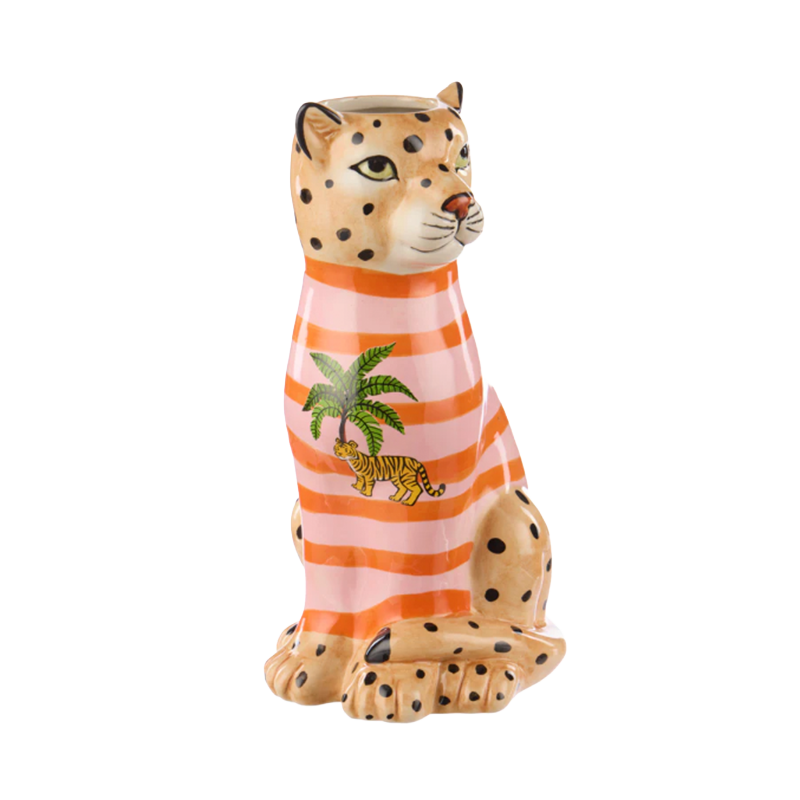 Ceramic leopard figurine wearing an pink and red striped shirt with a palm tree and tiger design 