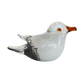 Glass seagull figurine on a white background