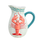 White pitcher with blue handle and red lobster design