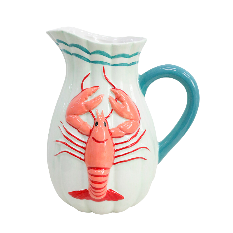 White pitcher with blue handle and red lobster design