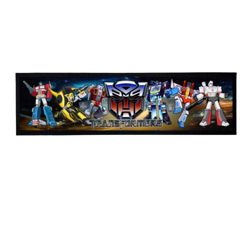 Transformers toy figures with the brand logo on a black  bar mat