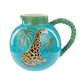 Ceramic jug with a giraffe design on a blue background