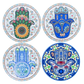 Set of four ceramic coasters featuring colourful decorative Hamsa hand designs with intricate patterns.