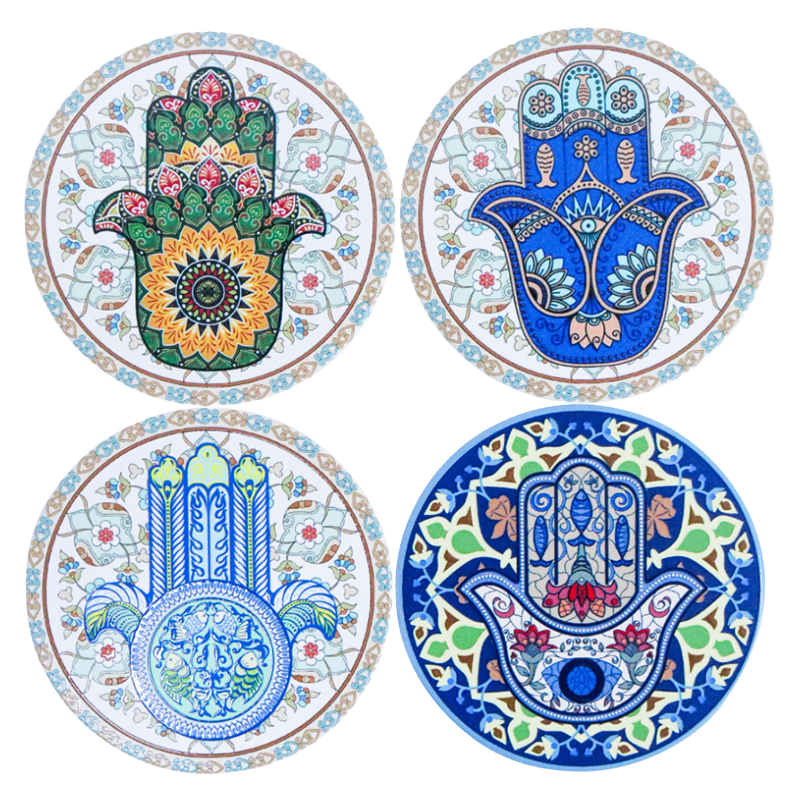 Set of four ceramic coasters featuring colourful decorative Hamsa hand designs with intricate patterns.