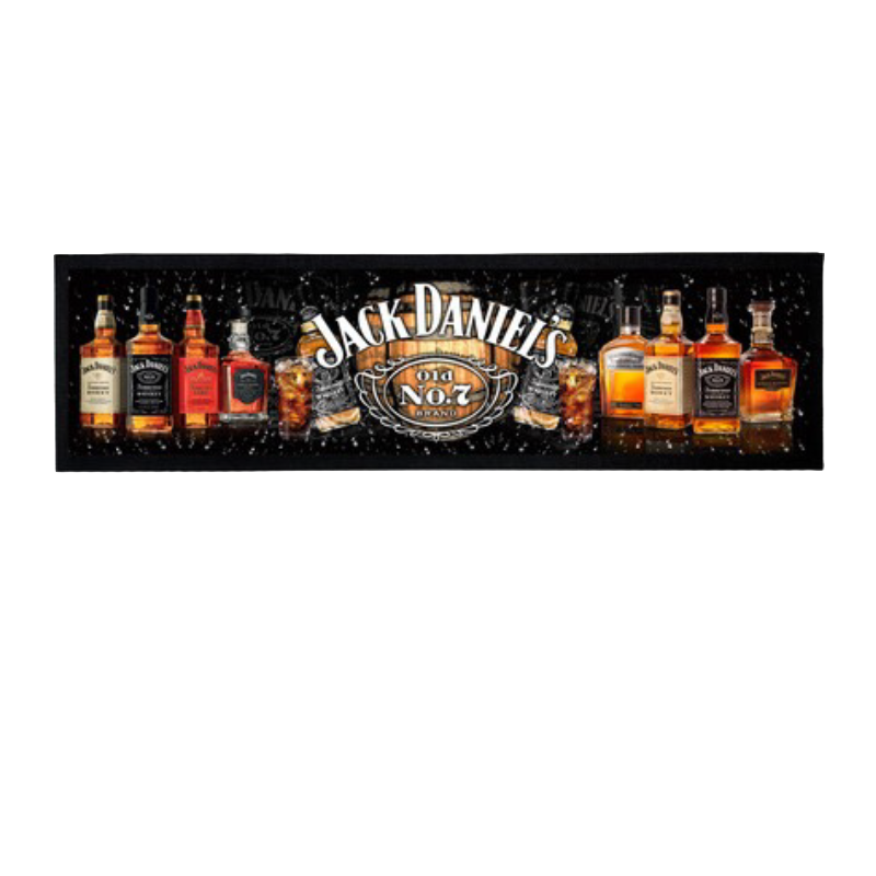 Jack Daniel's whiskey bottles arranged in a row with the brand logo in the center on a black bar mat.