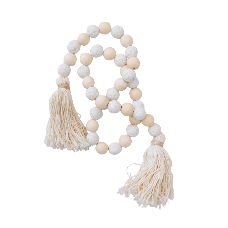 Decorative string of white stone and pink wooden beads with tassels o