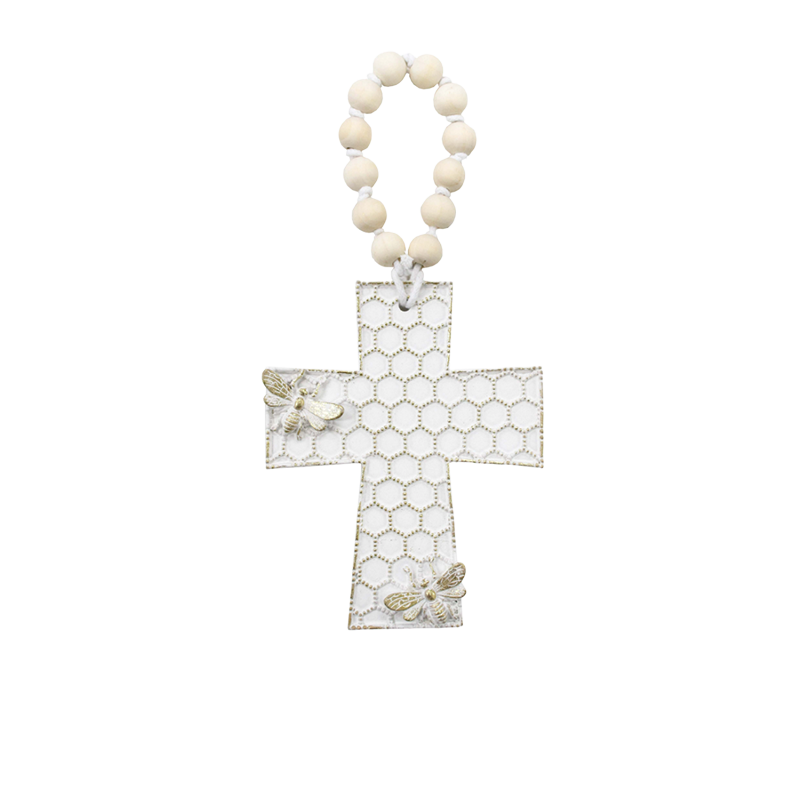 Decorative honeycomb cross ornament with bee detailing and hanging loop