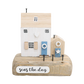 Decorative wooden house with 'seas the day' text on a white background