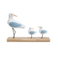 Decorative figurines of seagulls  on a wooden base 