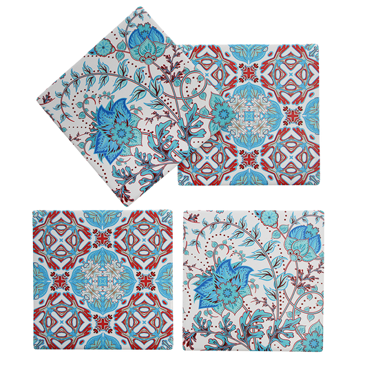 Set of four porcelain coasters with floral and geometric patterns on a white background
