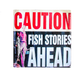 Coaster with 'Caution: Fish Stories Ahead' text and a person holding a fish.