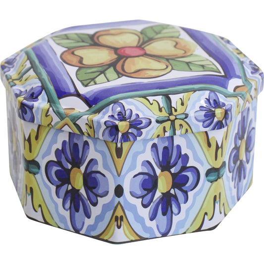 Mediterranean octagonal metal decorative tin with a blue, yellow and green floral pattern.