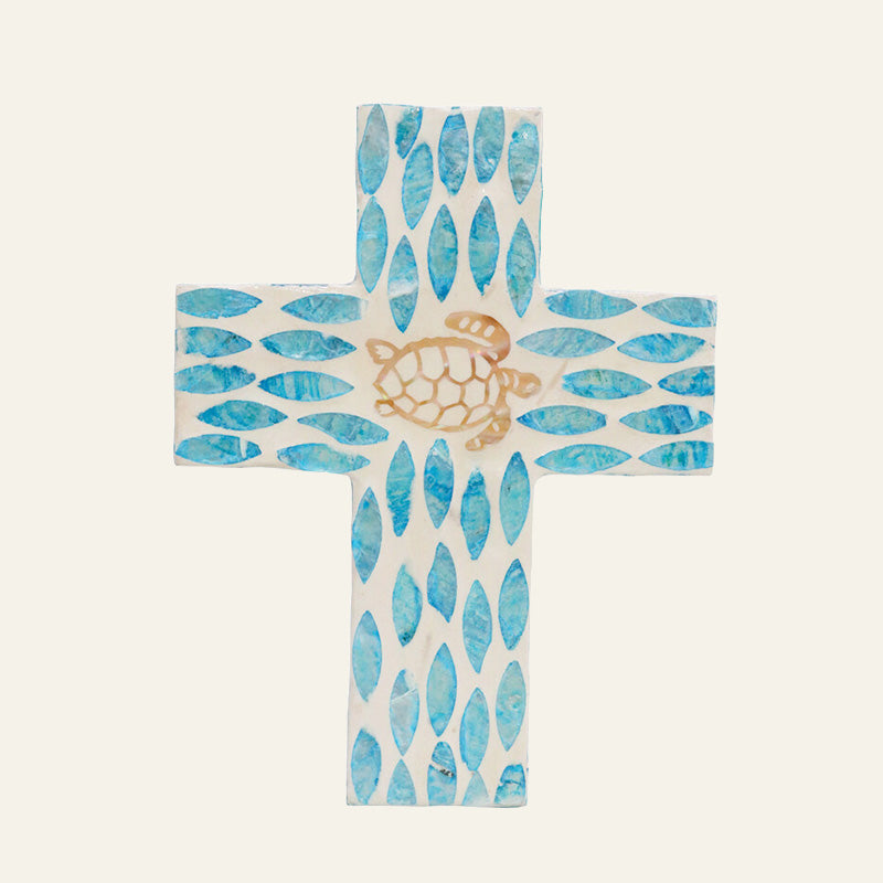 Decorative cross with turtle design and blue wave pattern 