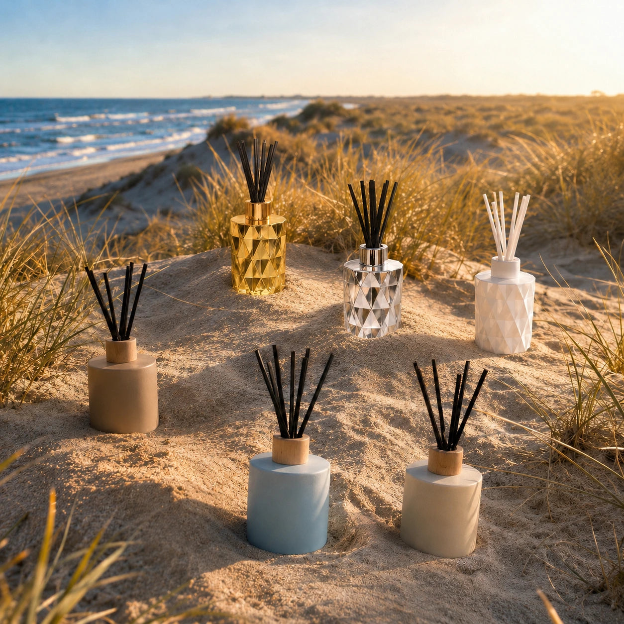 Collection of diffusers on a sandy beach with ocean view