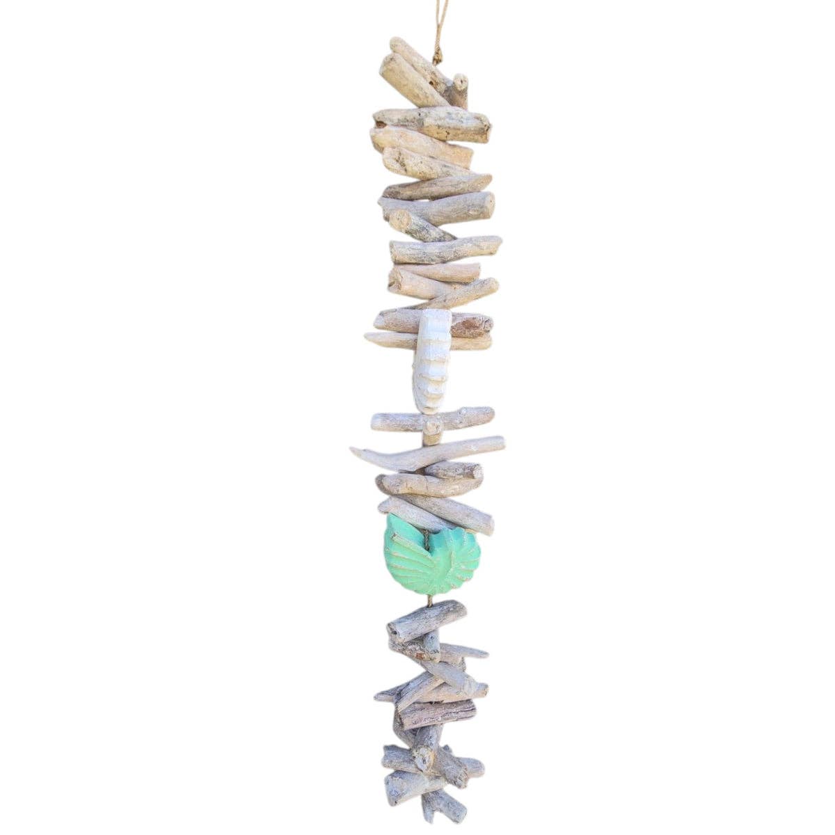 A vertical hanging decorative garland made of small driftwood pieces and shell-like accents, including a mint green shell near the center, shown on a plain white background.