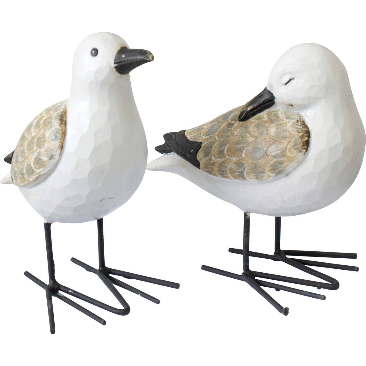 Pair of white coastal seagull ornaments with natural feather detailing and black iron legs.