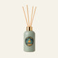 Green diffuser bottle with wooden sticks 