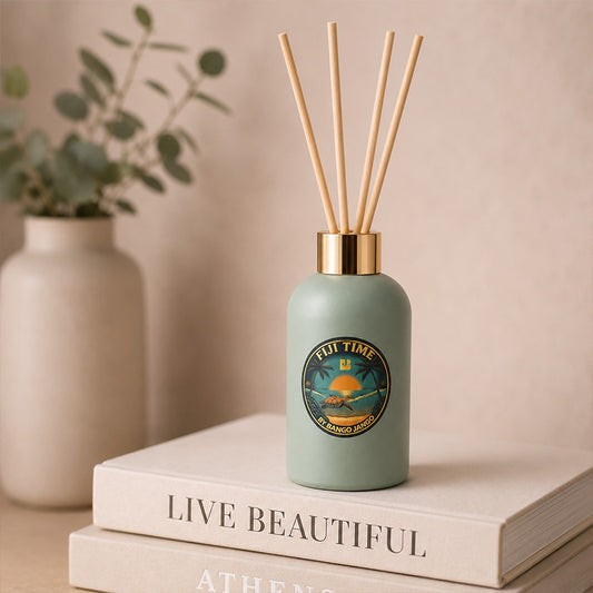 Green diffuser bottle on a stack of books 