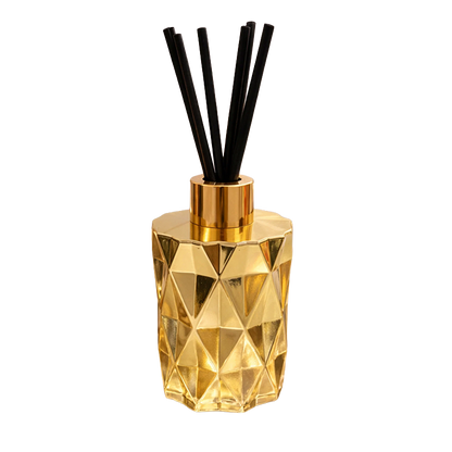 Gold geometric diffuser with black reeds 