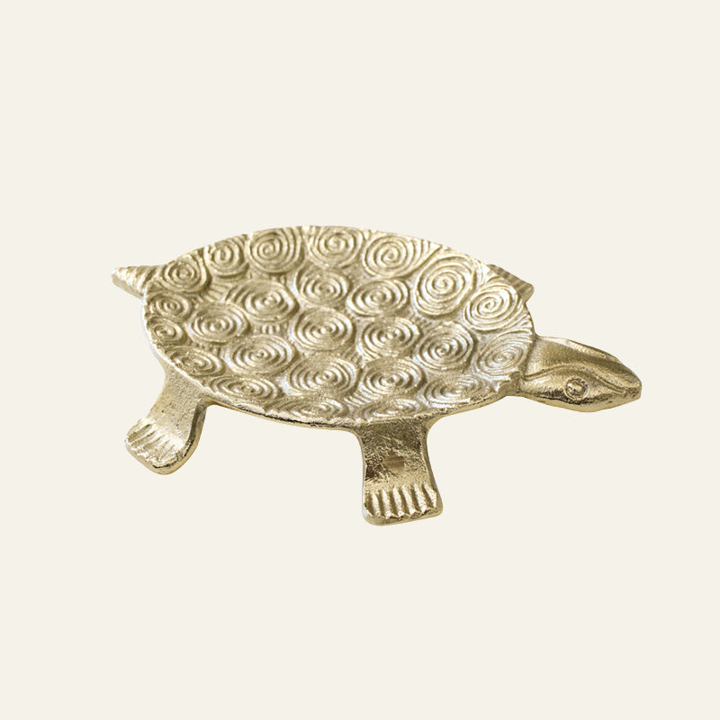 Gold-tone aluminium turtle trinket dish with textured shell design.
