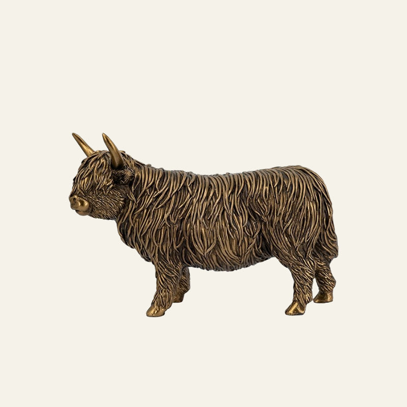 Antique bronze Highland Cow Figurine with detailed shaggy coat and curved horns.
