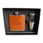 A men's gift set in a black presentation box, featuring a brown leather flask cover with 'MEN'S REPUBLIC' printed on it, a stainless steel flask, a small stainless steel funnel, and a small stainless steel cup.