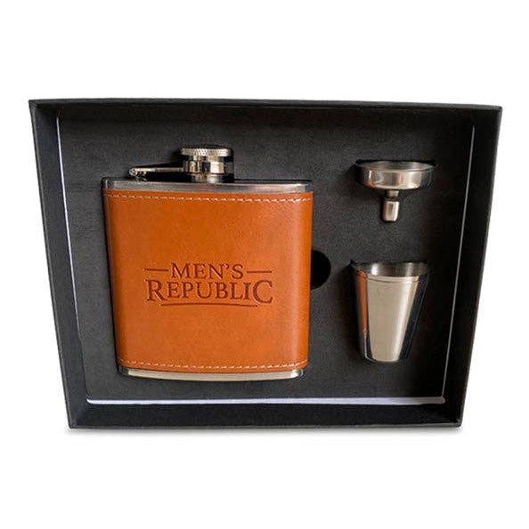 A men's gift set in a black presentation box, featuring a brown leather flask cover with 'MEN'S REPUBLIC' printed on it, a stainless steel flask, a small stainless steel funnel, and a small stainless steel cup.