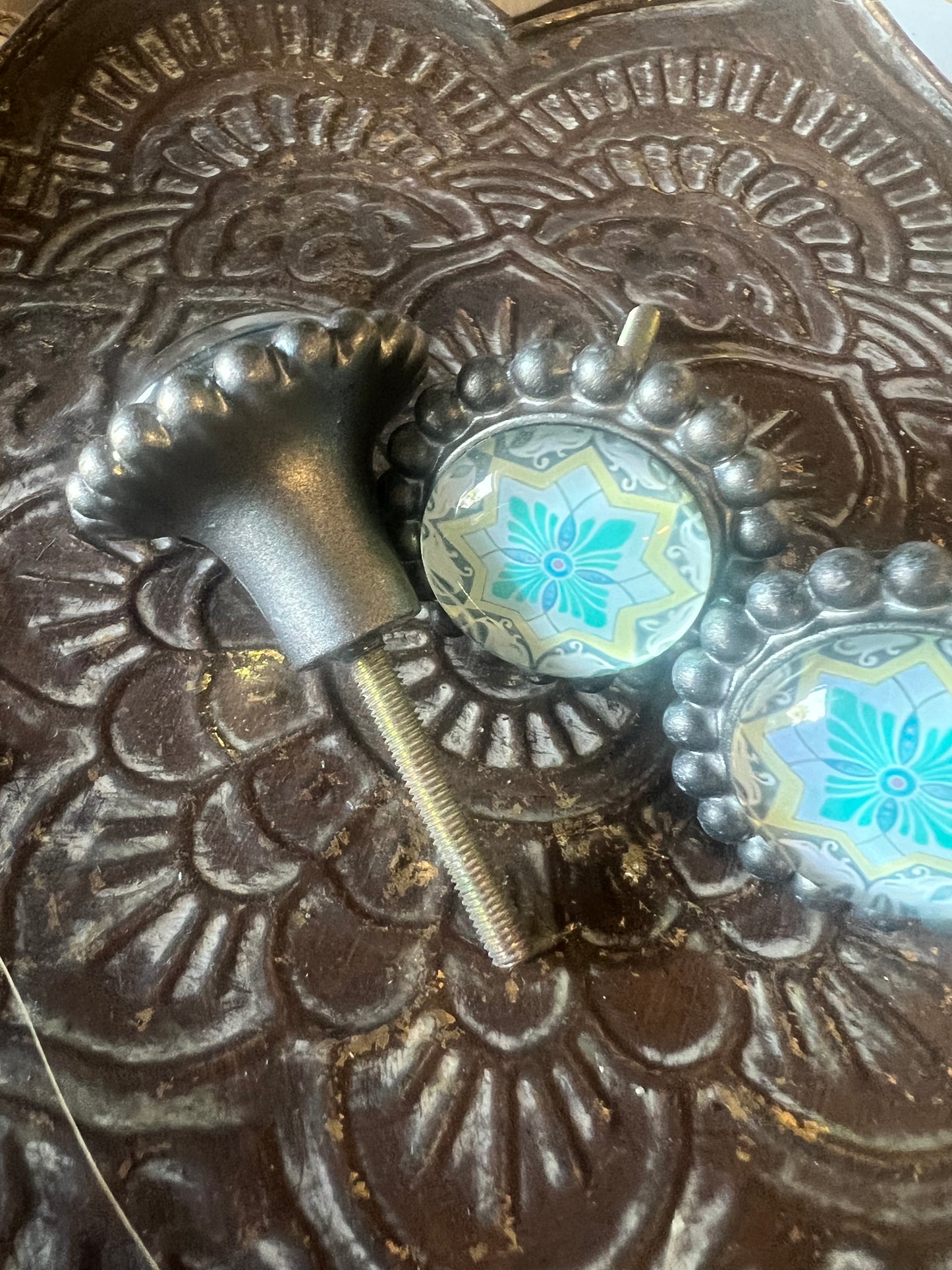 Aqua and yellow pattern door knobs