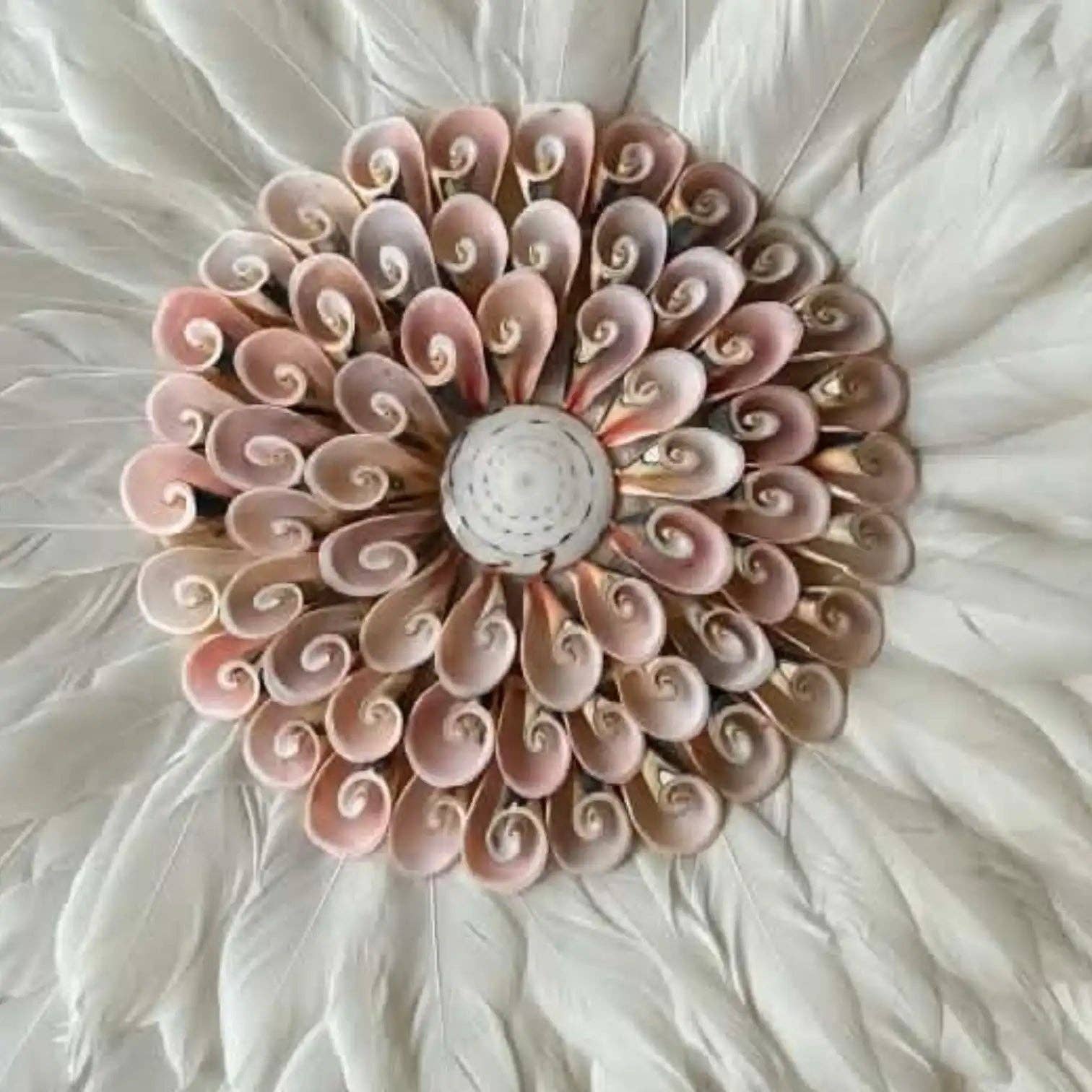 Decorative wall art with pink and beige swirl patterns on a white background