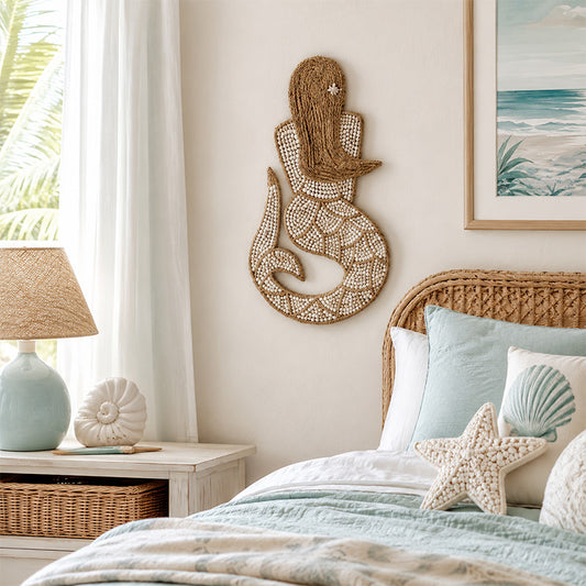 Natural rope mermaid wall hanging with white shell inlay detail and curled tail design hanging in bedroom