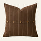 Square chocolate brown French linen cushion cover with fine natural stripes and coconut button detailing.