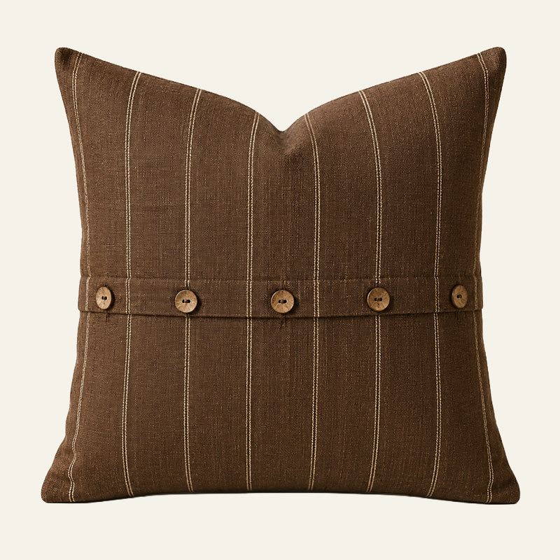 Square chocolate brown French linen cushion cover with fine natural stripes and coconut button detailing.