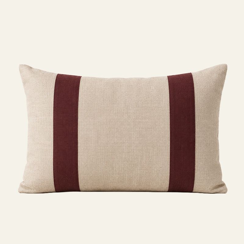 Rectangular natural linen lumbar cushion cover with two deep burgundy vertical panels.
