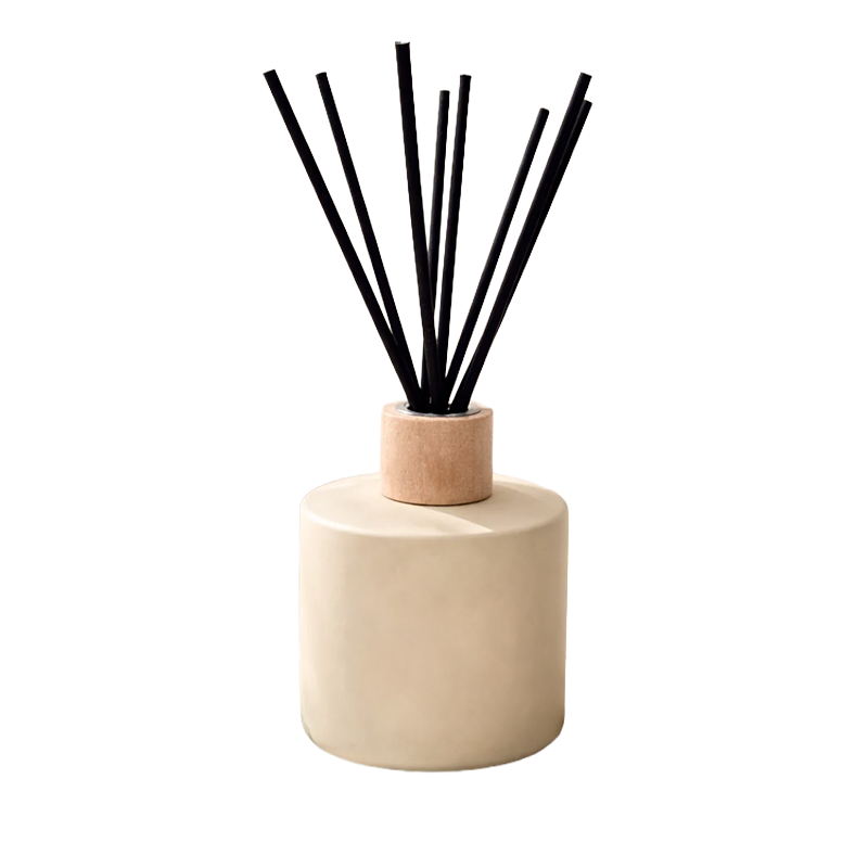 Diffuser with black sticks on a beige base 