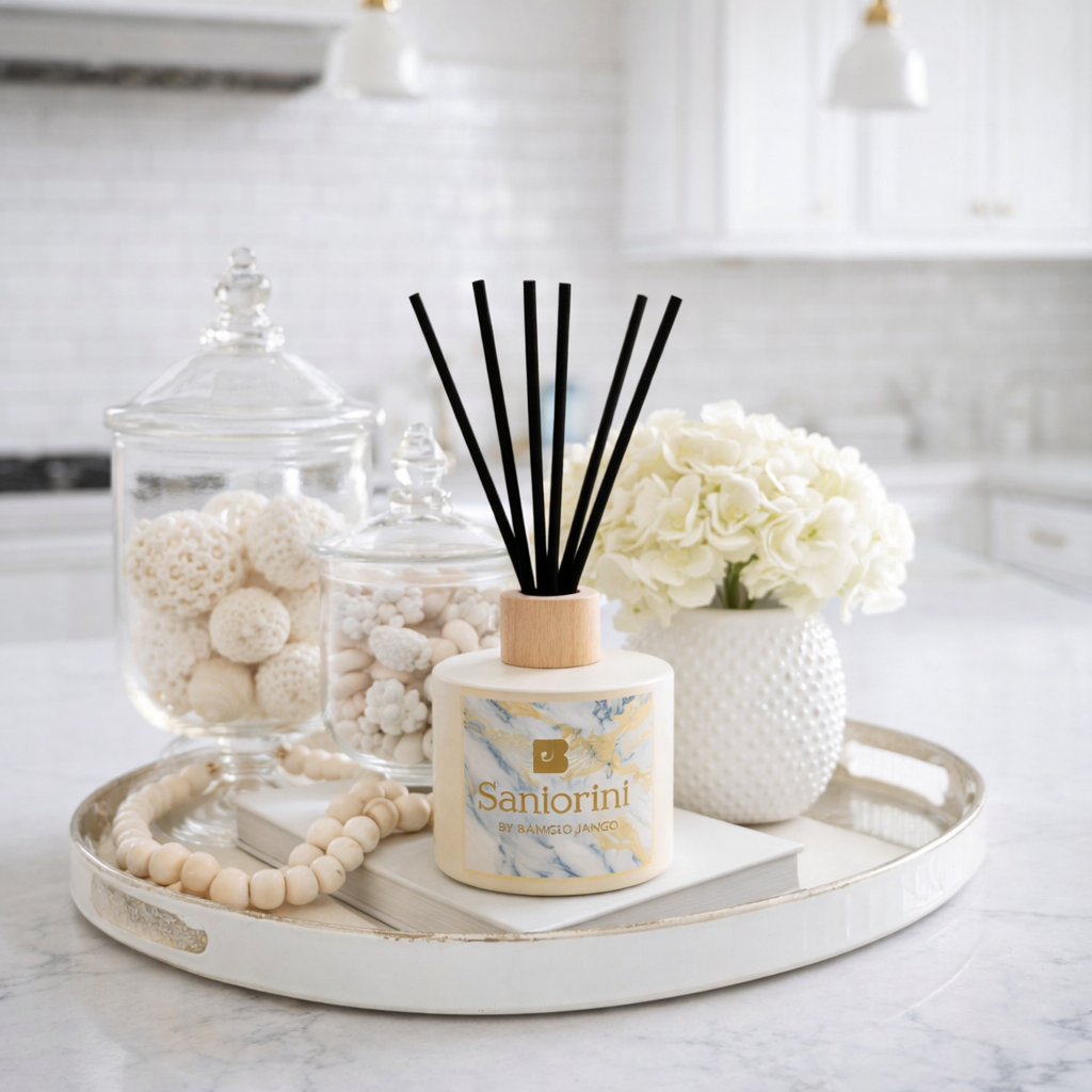 Decorative items including a diffuser, jar with decorative objects, and flowers on a tray in a kitchen.
