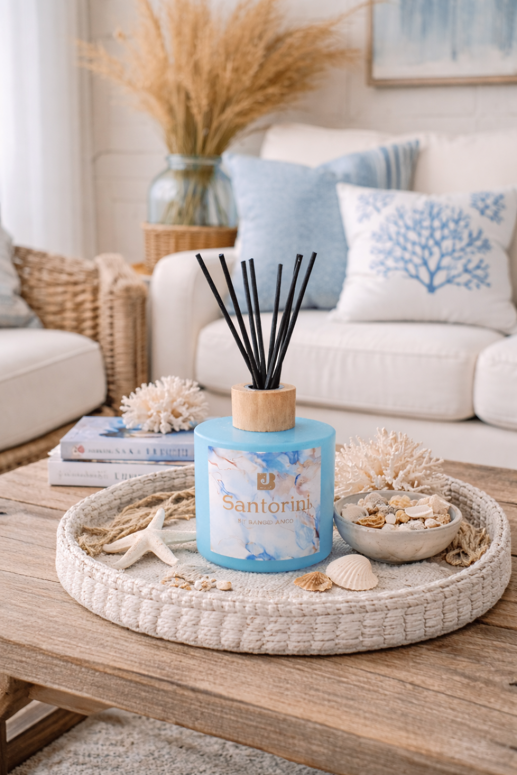 Santorini diffuser on a coffee table with decorative items in a living room setting