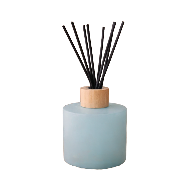 Diffuser with black sticks on a light blue bottle 